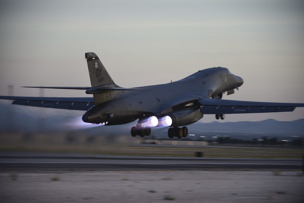 B-1 bomber takeoff with flaming afterburner