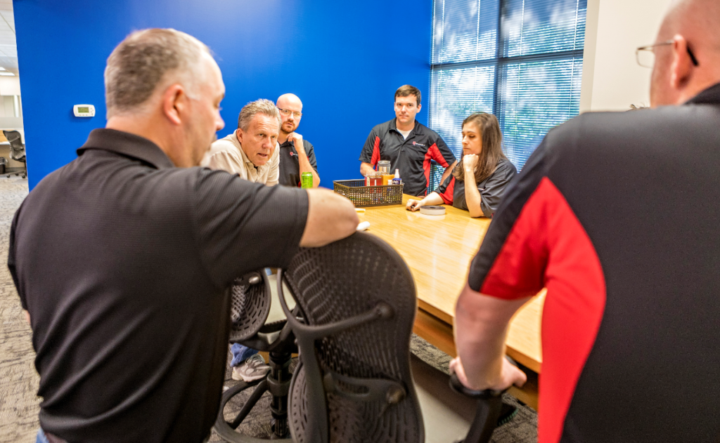 Gary Grossenbacher huddles daily with mechanical engineers to plan, prioritize and problem-solve. A lot of deep listening goes on all around. 